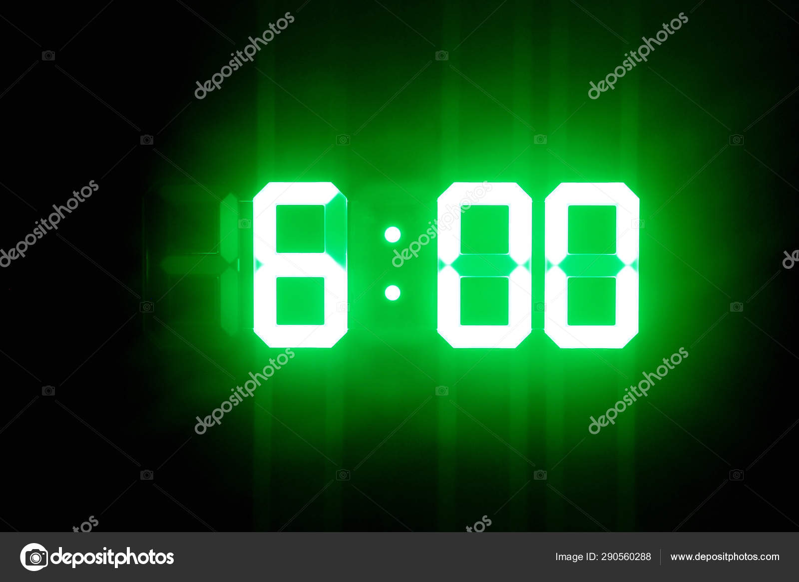 Green glowing digital clocks in the dark show 600 time Stock Photo by ©Tarkus 290560288