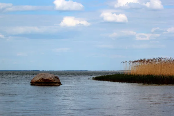 Holy stone, an erratic boulder and famous natural monument in Vistula lagoon near Tolkmicko, Northern Poland.