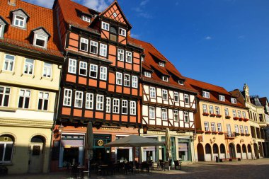 Quedlinburg, Germany - July 20, 2025: Quedlinburg Marktplatz with historic half-timbered houses and lively square