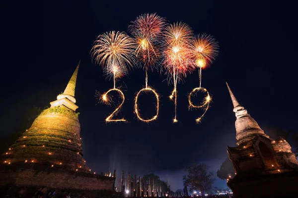 2019 Happy new year firework Sparkle with Sukhothai historical park at night, Thailand