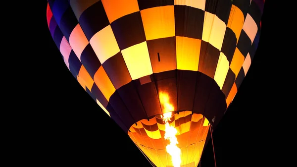 Close up of hot air balloon with burner flame glowing at night — Stock Photo, Image