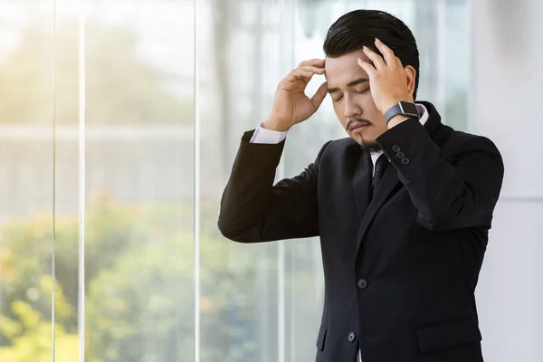 stressed business man thinking about problem in office