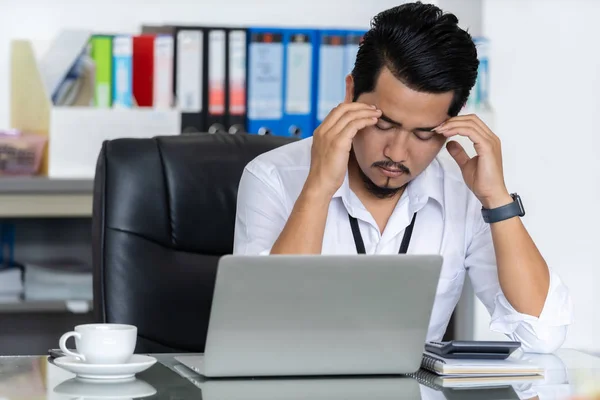 stressed business man using laptop and working problem