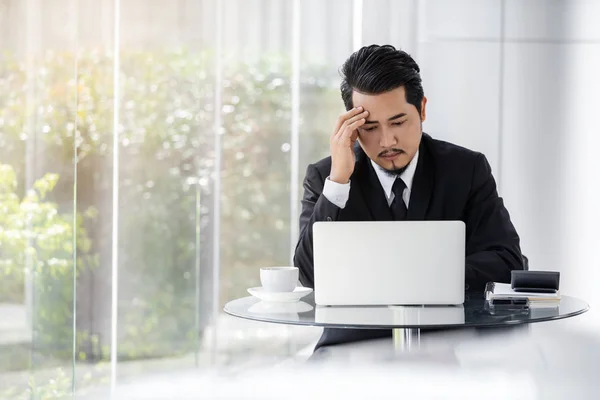 stressed business man using laptop and working problem