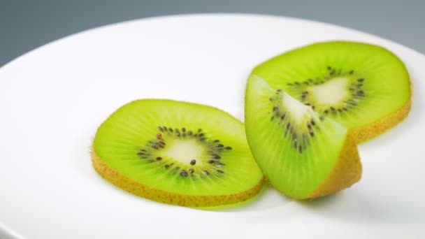 Fresh Kiwi Slice Slowly Rotating Studio Details — Stock Video