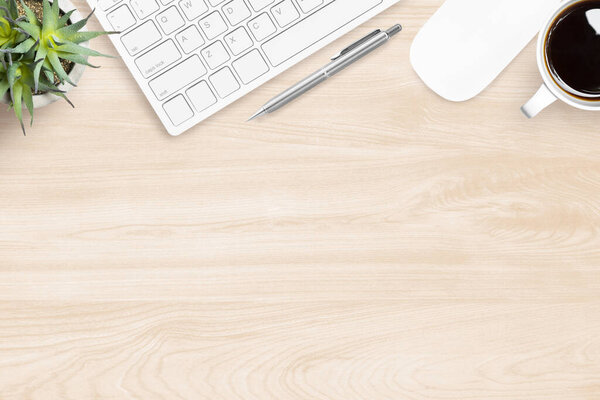 Wood office desk table with computer gadgets and supplies. Top view, flat lay.