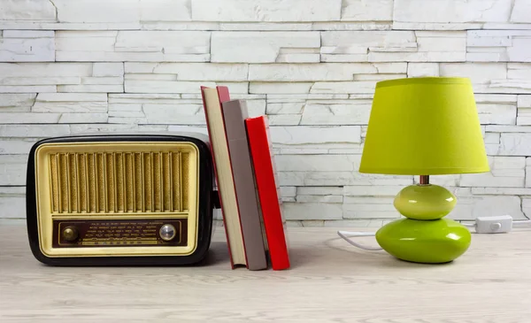 White Wooden Table with Books, a Lamp and a Vintage Radio — Stock Photo, Image