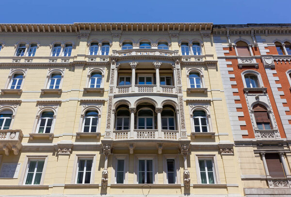 TRIESTE, Italy - June 21, 2019: Richly decorated exterior facade of a newly renovated elegant historic building in Corso Italia