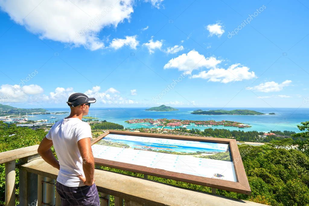 Tourist is admiring panoramic view of Victoria and Eden Islands,