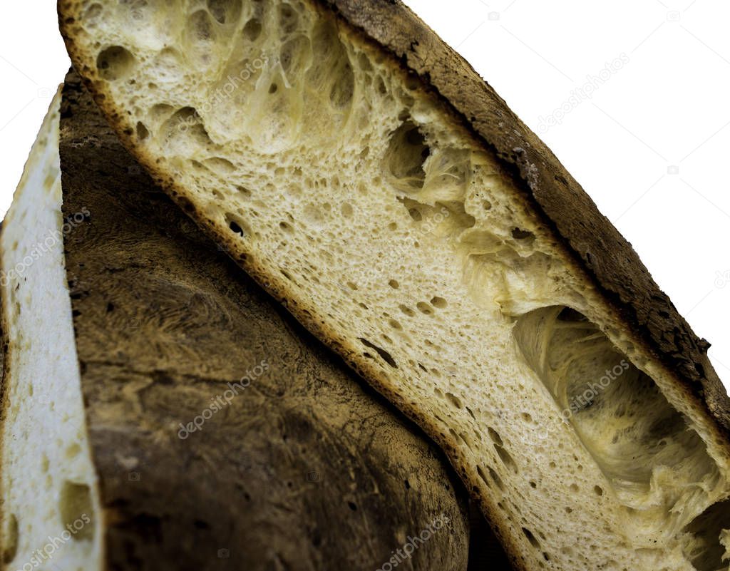 Fresh whole grain apulian bread cut in half on white background