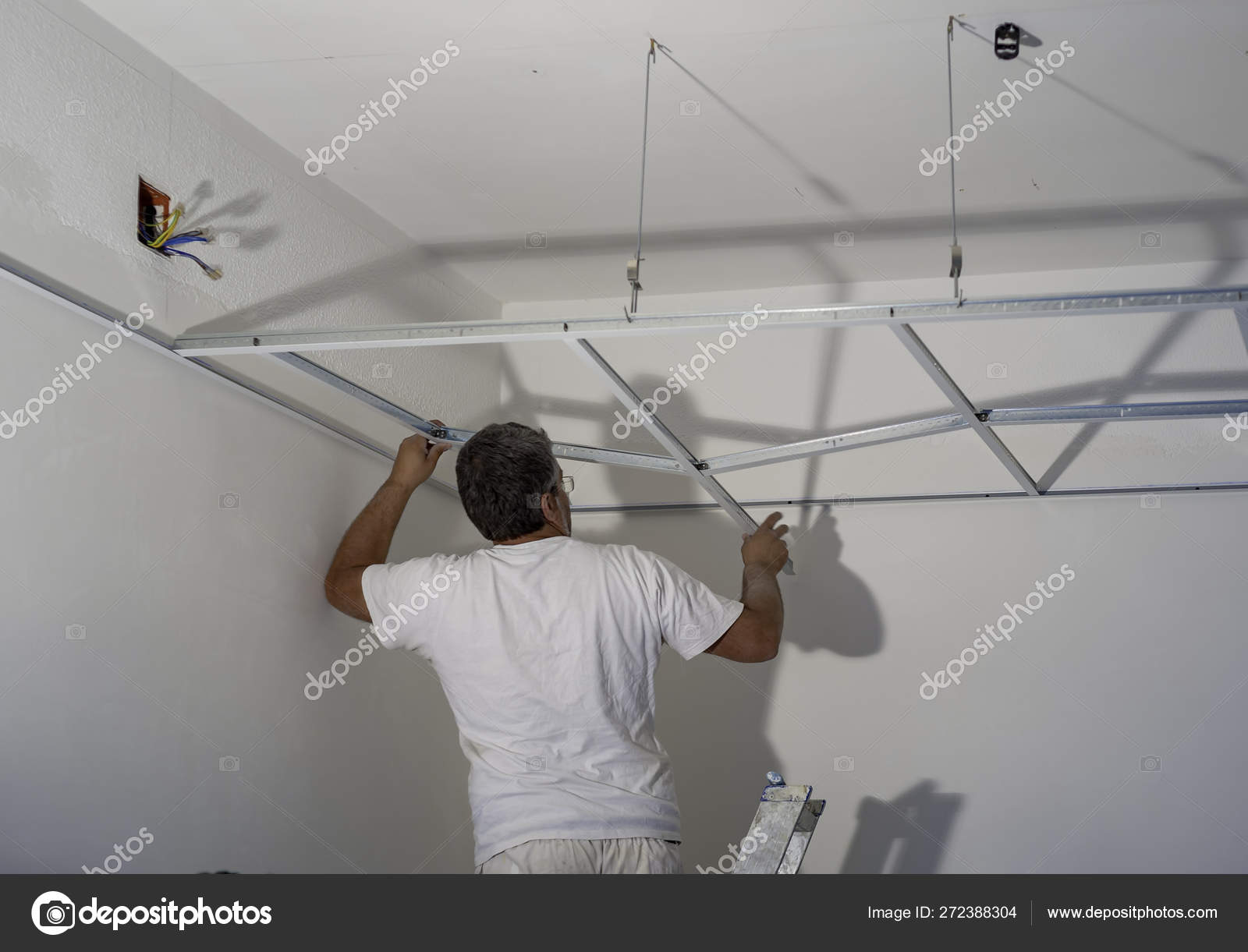 Construction Worker Assemble Suspended Ceiling Drywall Fixing