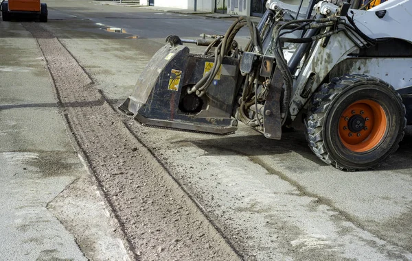 Milling of asphalt for road reconstruction accessory for skid steer