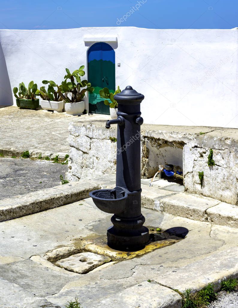 Old fountain in Ostuni Old town. Apulia.