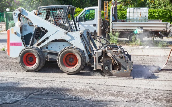 Milling of asphalt for road reconstruction accessory for skid steer