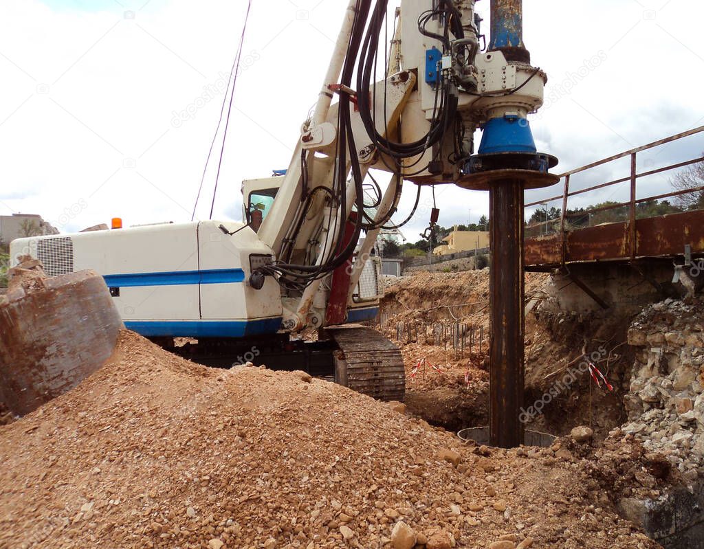 heavy duty machinery used for drilling holes in the ground on construction site. Highway building details with rotary drilling machine