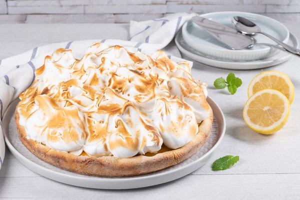 Lemon tart pie with meringue cream. Traditional American cake. Homemade baking. Copy space.