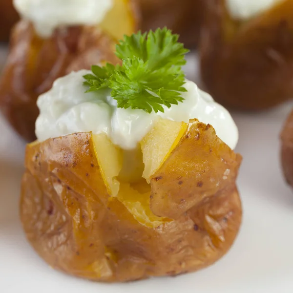 Mini Baked Potatoes with Blue Cheese Dressing. — Stock Photo, Image
