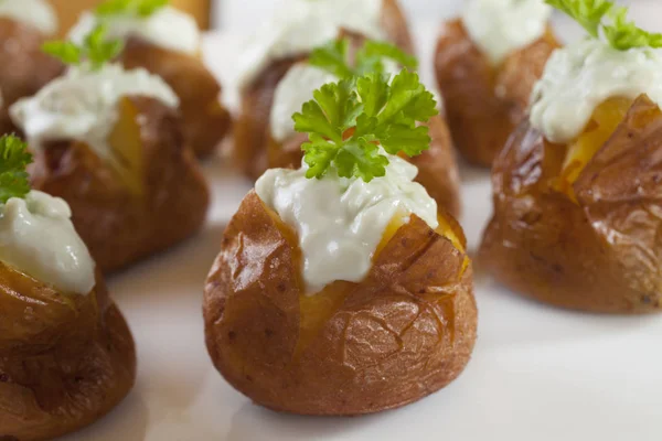 Mini Baked Potatoes with Blue Cheese Dressing. — Stock Photo, Image