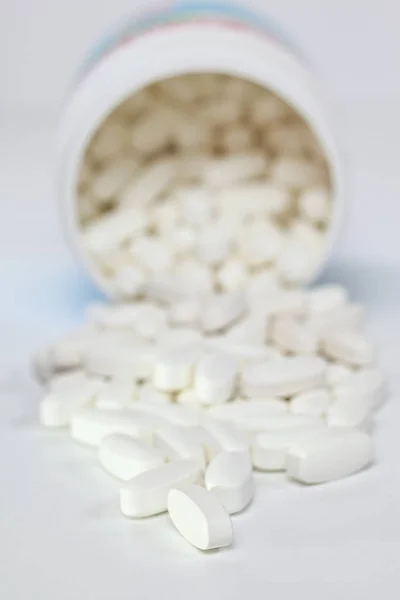 Pills Spilling from Container Royalty Free Stock Photos