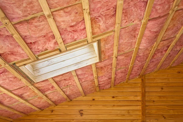 Pink Fiberglass Roof Insulation in Sloping Roof — Stock Photo, Image