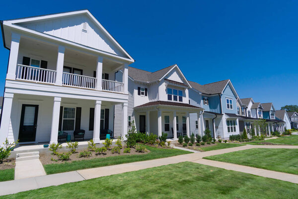 A row of patio homes with a common lawn area