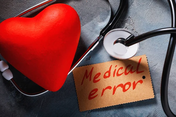 Medical error concept: stethoscope and heart shaped object