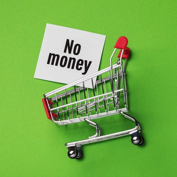 No money to buy goods in the store. Note in the grocery cart