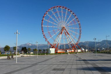  Batumi, Georgia - December 5, 2019: Ferris wheel on the embankment of Batumi at sunny day