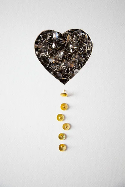 Tacks heart on white background useful for graphic projects for Valentine's Day and other love celebrations