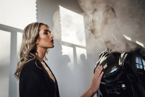 Fashion photography. Beautiful caucasian  woman and mannequin