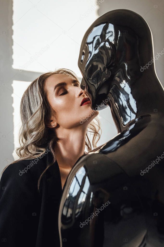 Fashion photography. Beautiful caucasian  woman and mannequin