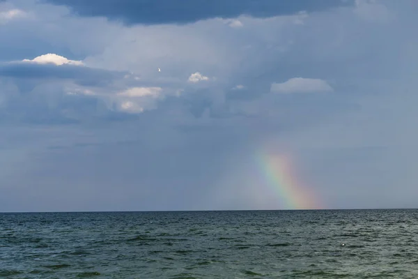 Rainbow under storm sea nature color ecology