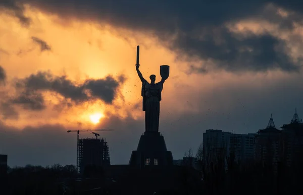 The Motherland Monument sunset swarm of birds Kiev