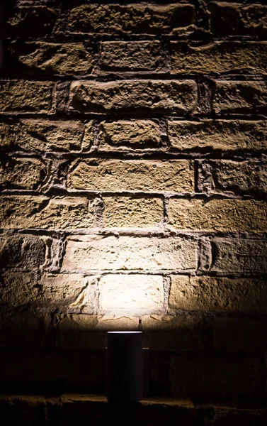 Wall light on brick and shade. Lights wall abstract background