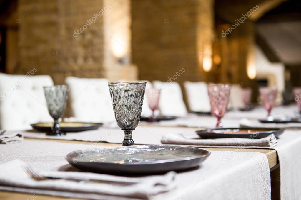 Empty glasses set in restaurant. Banquet table set