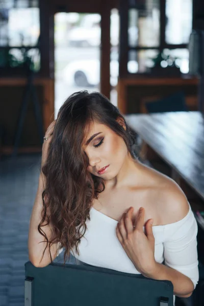 Portrait of a young woman in a cafe. Woman closed her eyes — Stock Photo, Image