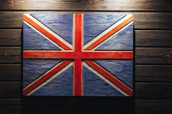 United Kingdom flag on wood background. Grunge United Kingdom flag. Wooden flag United Kingdom on a wooden wall