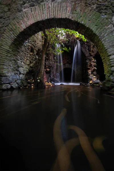 Waterfall in the ruins of an old mill. Nature scene, magical and relaxing — Stock Image Waterfall Ruins Old Mill Nature Scene Magical Relaxing Royalty Free Stock Images