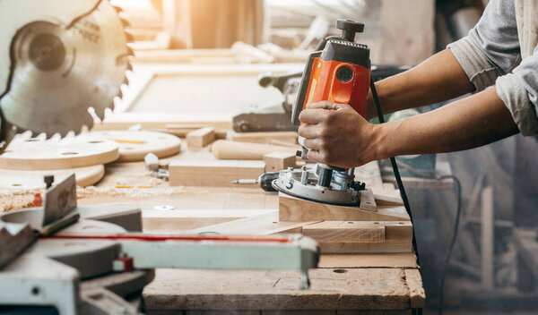 Carpenter working of manual milling machine in the carpentry