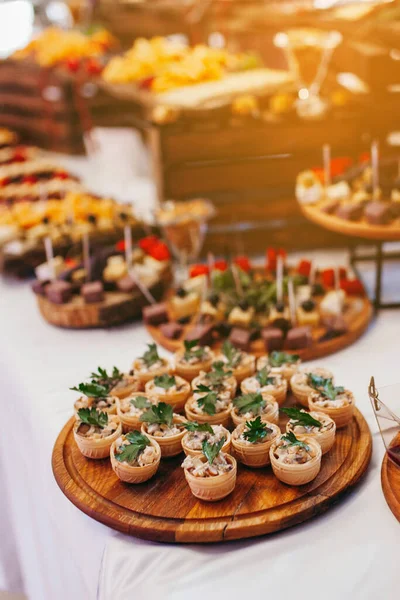 Luxury food and drinks on corporate party table.