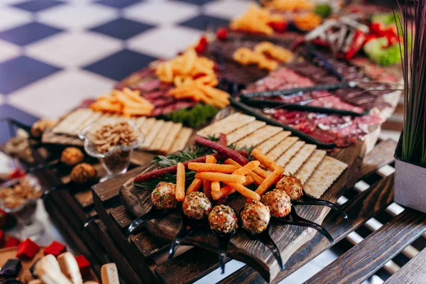 Luxury food and drinks on corporate party table.