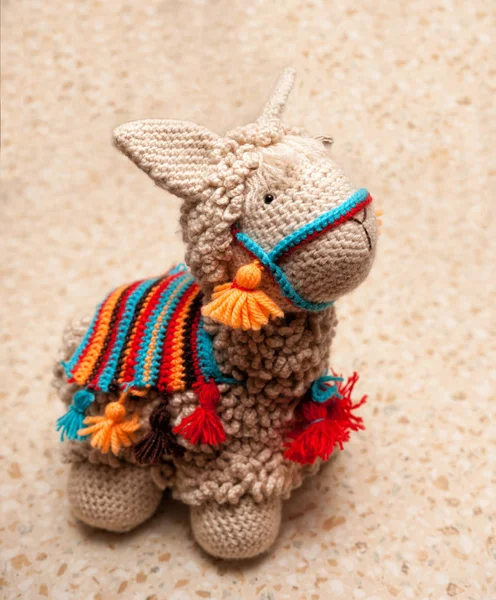 Handmade knitted toy. Lama