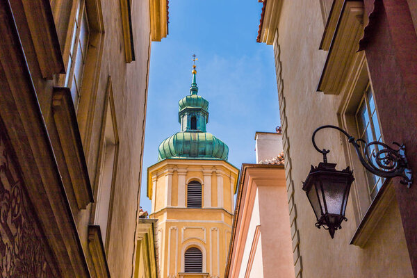 Warsaw Poland. April 25 2019. A view of st Martins church through an alleyway in the old town in in Warsaw in Poland