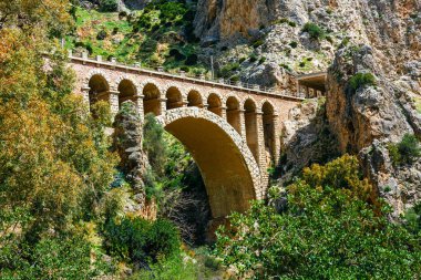 stone railway bridge in the village of el chorro at the end of trail of Caminito Del Rey clipart