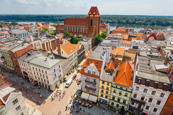 Torun, Poland - June 01, 2018: Aerial view of historical buildings and roofs in Polish medieval town Torun, Poland. Torun is the place where the Nicolaus Copernicus was born