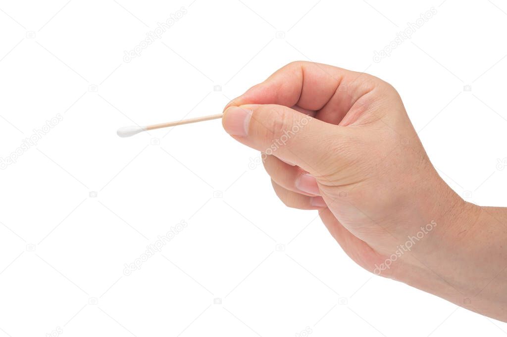 Close-up of a mans hand holding a cotton swab on a white background.