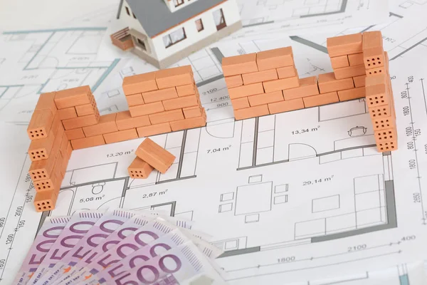 Model house construction with brick on blueprint — Stock Photo, Image