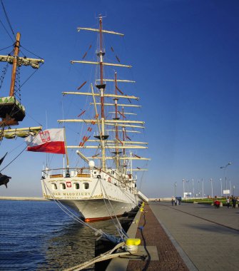 GDYNIA, POLAND: SEPTEMBER 29, 2017: STS Gift of the Youth (Dar Mlodziezy) - three-masted Polish training frigate type B-95 in Gdynia port over Baltic Sea, Poland`