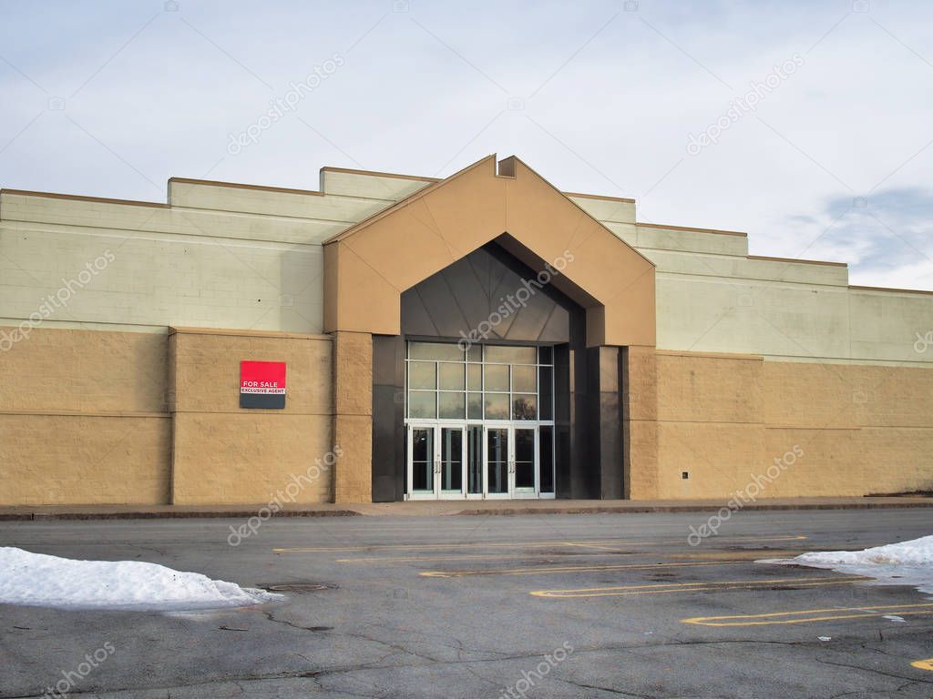 Nearly vacant American mall , an example of the downward trend of   brick and mortar retail  since the popularity of online shopping