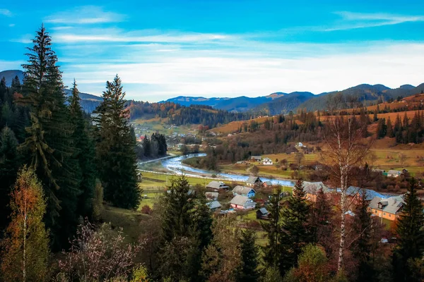 Autumn in the mountains. Mountains, forests and fields in autumn colors